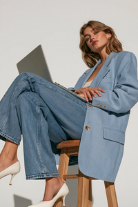 u6512682322_a_cropped_shot_of_a_person_sitting_on_a_wooden_st_19552e87-ae99-4dd2-bcbe-78847928eb9d_3