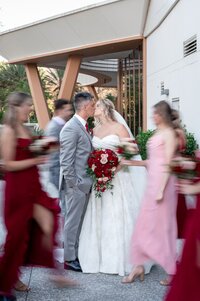 Wedding party celebrating with the bride and groom at an Orlando wedding