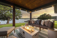 Enjoy your evenings sitting lakeside under this lit up covered patio complete with comfy furnishings and fire table for those chilly summer nights