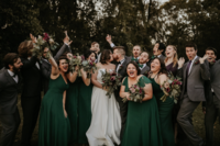Bridal party celebrating bride and groom kiss at Nashville wedding ceremony