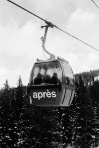 Powder - Vintage cable car with passengers suspended above snowy moun - TVS