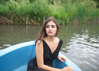 woman-sitting-in-blue-boat-eastern-suburbs-melbourne