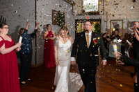 bride-groom-under-butterfly-confetti-wedding-kc