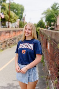 A classic photo taken by Studio Roscher of a happy high school female graduate in Alexandria, VA