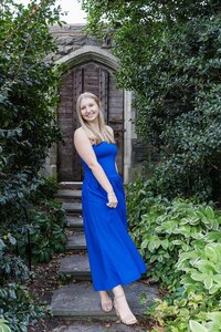 A classic photo taken by Studio Roscher of a happy high school female graduate in Alexandria, VA