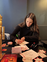 Nyssa working in the Use Your Words studio while designing custom calligraphy pieces and luxury event details.