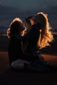 Couple backlit by motorcycle light- utah couples photographer