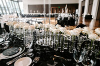 Wedding reception details Flowers in vases table centerpieces