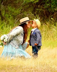 bridge grandma kissing Jayden flowers behind back