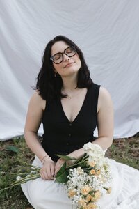 serene-portrait-woman-flowers-white-backdrop-large