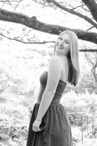 A classic photo taken by Studio Roscher of a happy high school female graduate in Alexandria, VA