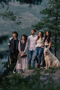 Family poses in front of a lake- utah county family photographer