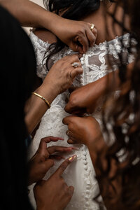 hands-buttoning-bride-wedding-dress-sheraton-kansas-city