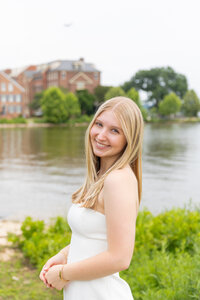 A classic photo taken by Studio Roscher of a happy high school female graduate in Alexandria, VA