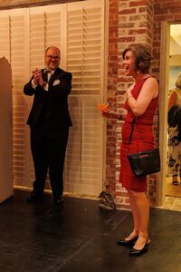 The moment of surprise for the woman in the red dress at a birthday party in Richmond, VA
