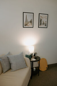 Chair and end table with lampin a room