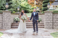 couple posing candidly after getting married at Lord Hill Farms.