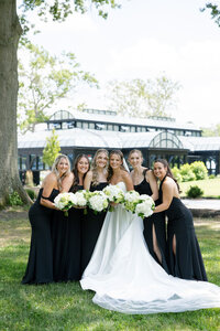 bride posing with her wedding party