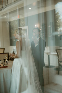 groom shows off his new wedding ring after ceremony at brookside country club in macungie pa.