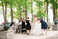 Wedding planner with Weddings & Events by Raina assist with bustling your wedding dress