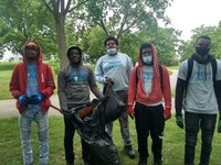 Copy of Richard, Kamazen, Donaven, Stasun, and Octavio pose with the bag of litter they collected around the pond