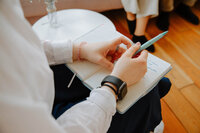 womens-therapist-with-notebook-open