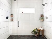 CanB Design- Curated Modern Build Project- Primary Bath-walnut-modern-slab-cabinets-green-sconces- Photo 21