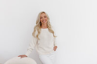 Celeste posed in a cream outfit during a La Quinta branding photography session