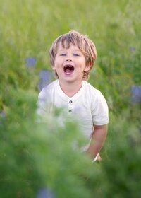 joyful-boy-portrait-wildflower-meadow-melbourne