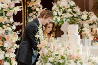 bride and groom cutting cake