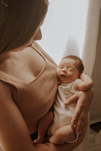 mom holding a a newborn baby