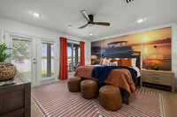Elegant Sunset Suite bedroom with warm sunset lighting in Graford lake house