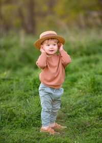 playful-toddler-portrait-with-hat-melbourne-family-photographer