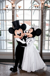 Mickey and Minnie Mouse in wedding attire at Disney World wedding