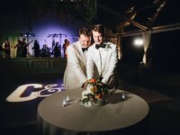 Will and Cameron cake cutting same-sex wedding reception at Cheekwood Botanical Garden Nashville — Weddings & Events by Raina