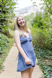 A classic photo taken by Studio Roscher of a happy high school female graduate in Alexandria, VA