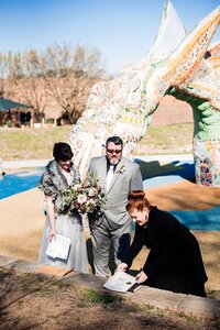 Wedding Officiant with Weddings & Events by Raina signs marriage license