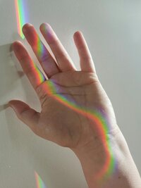 Prismatic light falling across a hand, part of the expressive lifestyle imagery used throughout the Adventurous Heart Therapy brand
Select 81 more words to run Humanizer.