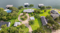 Stunning aerial perspective of the property and surrounding lake