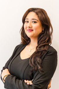 A classic professional portrait taken by Studio Roscher of a female professional smiling in a studio