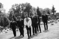groom casually walking with his groomsmen during a candid wedding shoot
