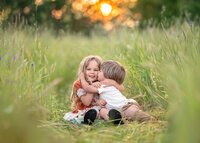 siblings-cuddling-in-wildflower-field-melbourne