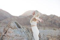 Celeste posed against a neutral backdrop during a La Quinta branding photography session