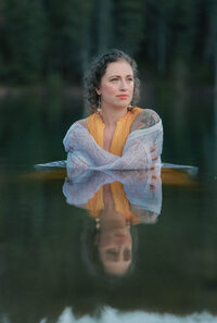 Woman poses for a photo in tibble fork reservoir- utah county branding photographer