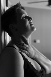 Black and white photograph of a Studio Roscher female boudoir client in Richmond, VA