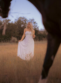 Girl in the distance framed by a horse's head- salt lake city photographer