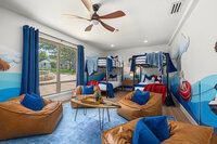 fun sleeping and gaming space for the kids with bunks and comfy seating