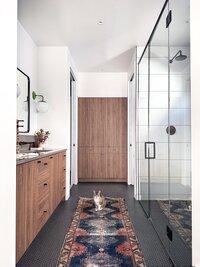 CanB Design- Curated Modern Build Project- Primary Bath-walnut-modern-slab-cabinets-green-sconces- Photo 1