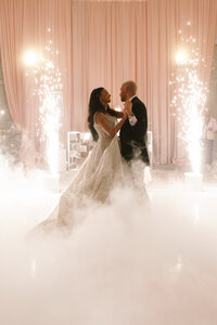 Bride and Groom dancing in clouds