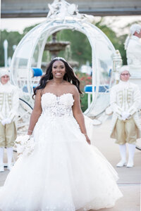 bride exits from Cinderella carriage at Disney World wedding
